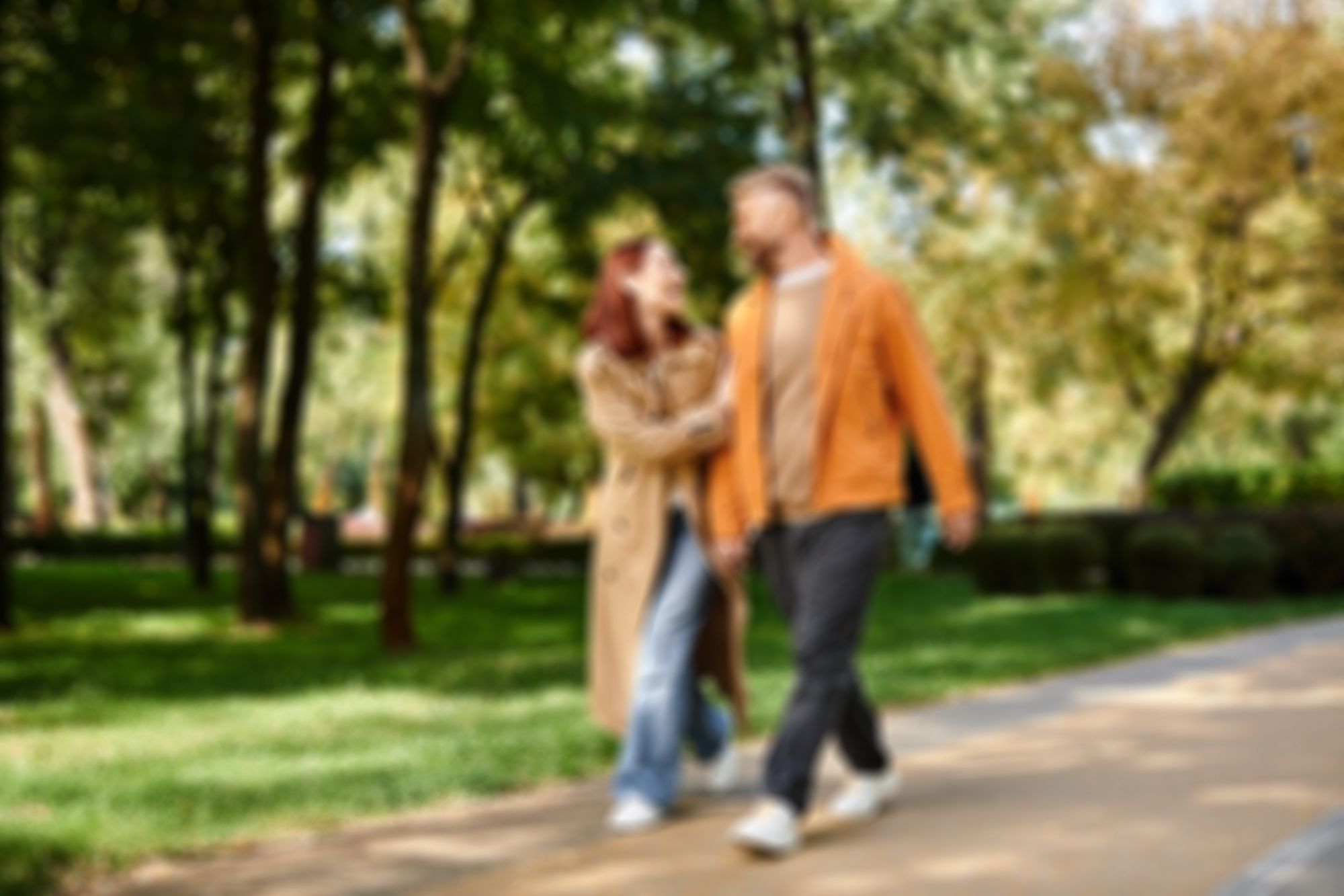 Couple walking through a park while enjoying comfortable vision and eye health supported by professional optometry care – eye doctor los angeles